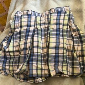 Plaid skirt goes to about mid thigh, size 1
